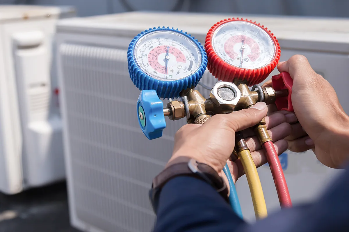 Technician Is Checking Air Conditioner ,measuring Equipment For